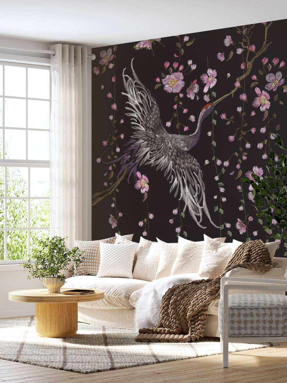 Cranes with pink flowers