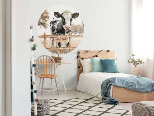 Young cow in a meadow taupe