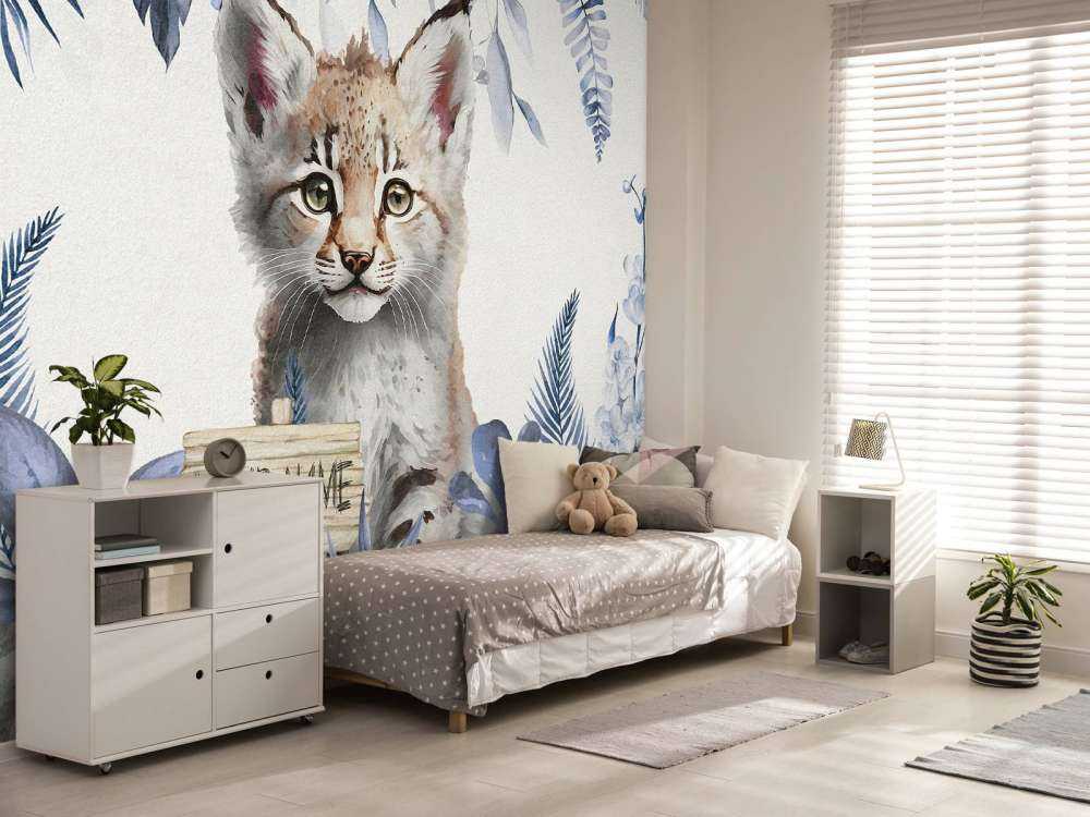 Baby lynx in the jungle blue