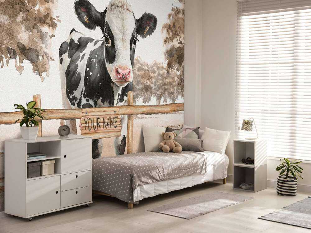 Young cow in a meadow taupe