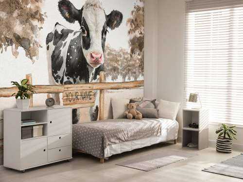 Young cow in a meadow taupe