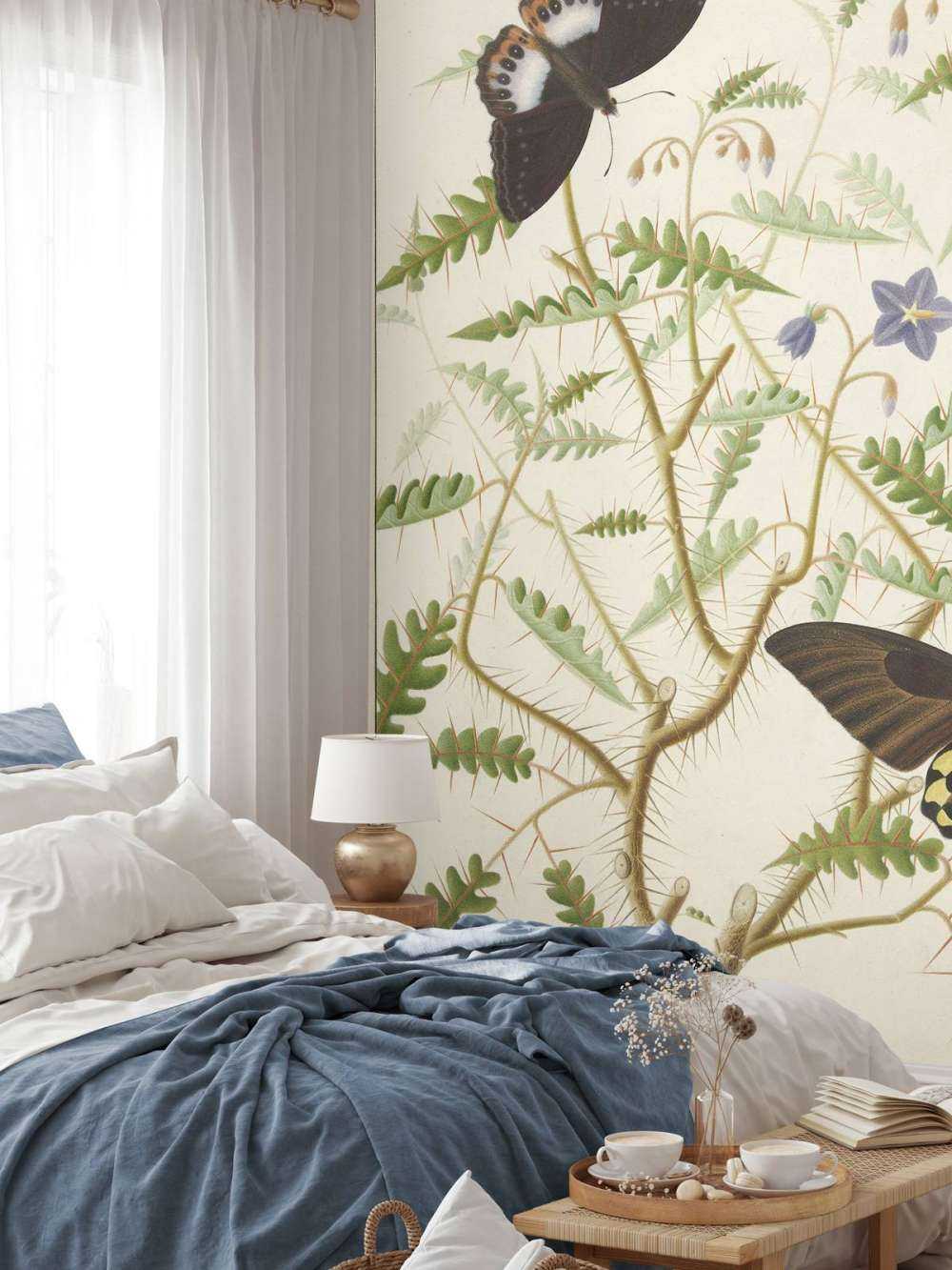 A blossoming shrub with two exotic butterflies