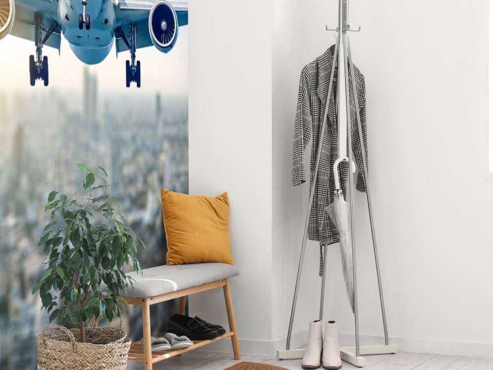 Descending airplane over a city