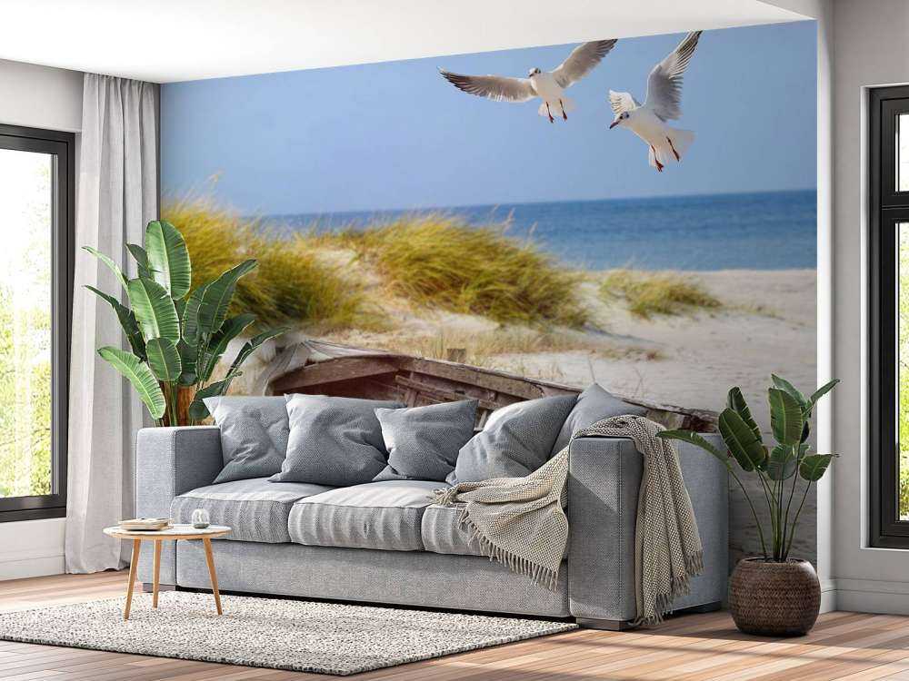 Old fishing boat, seagulls, beach and sea