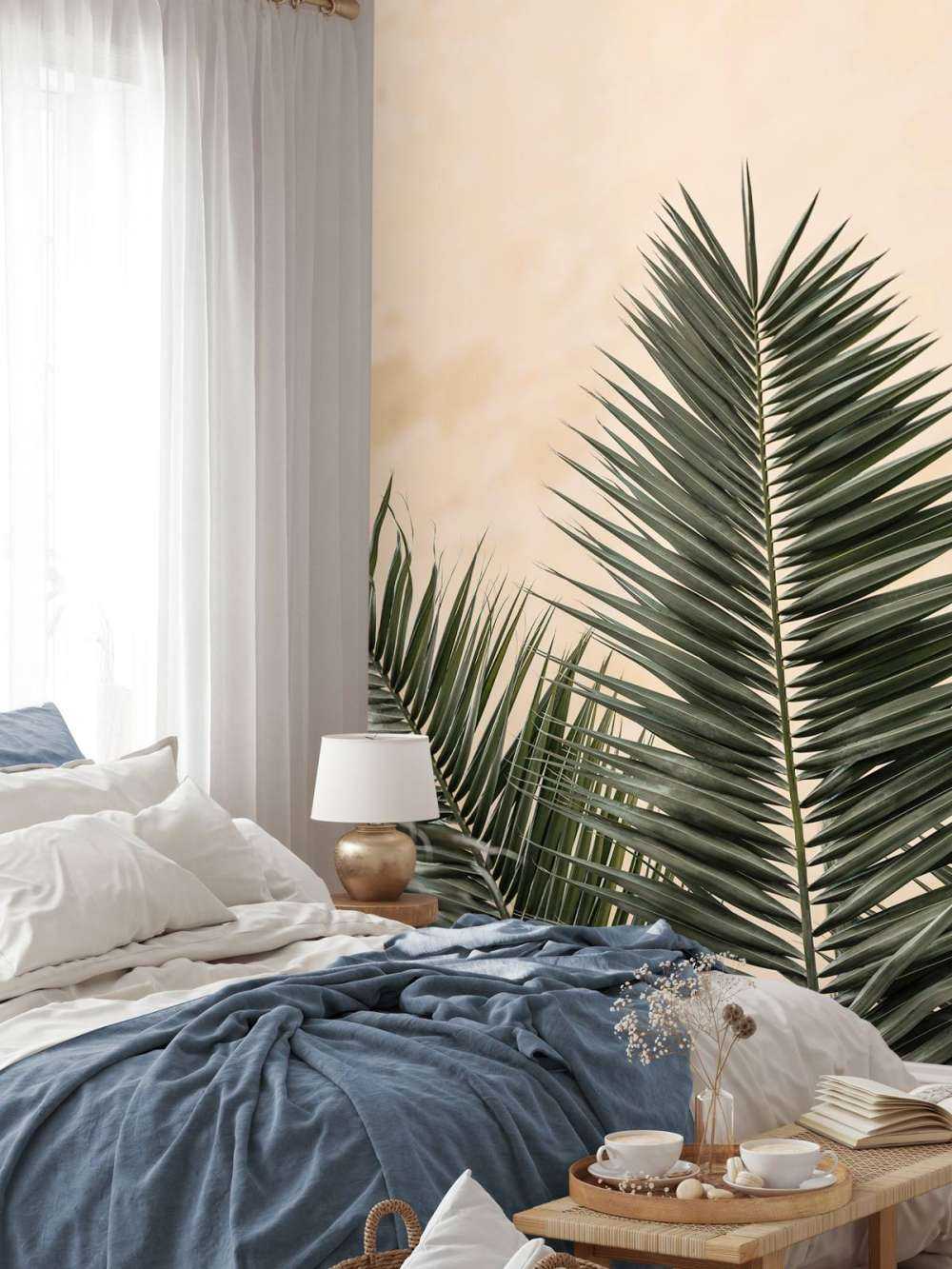 Palm leaves and wall