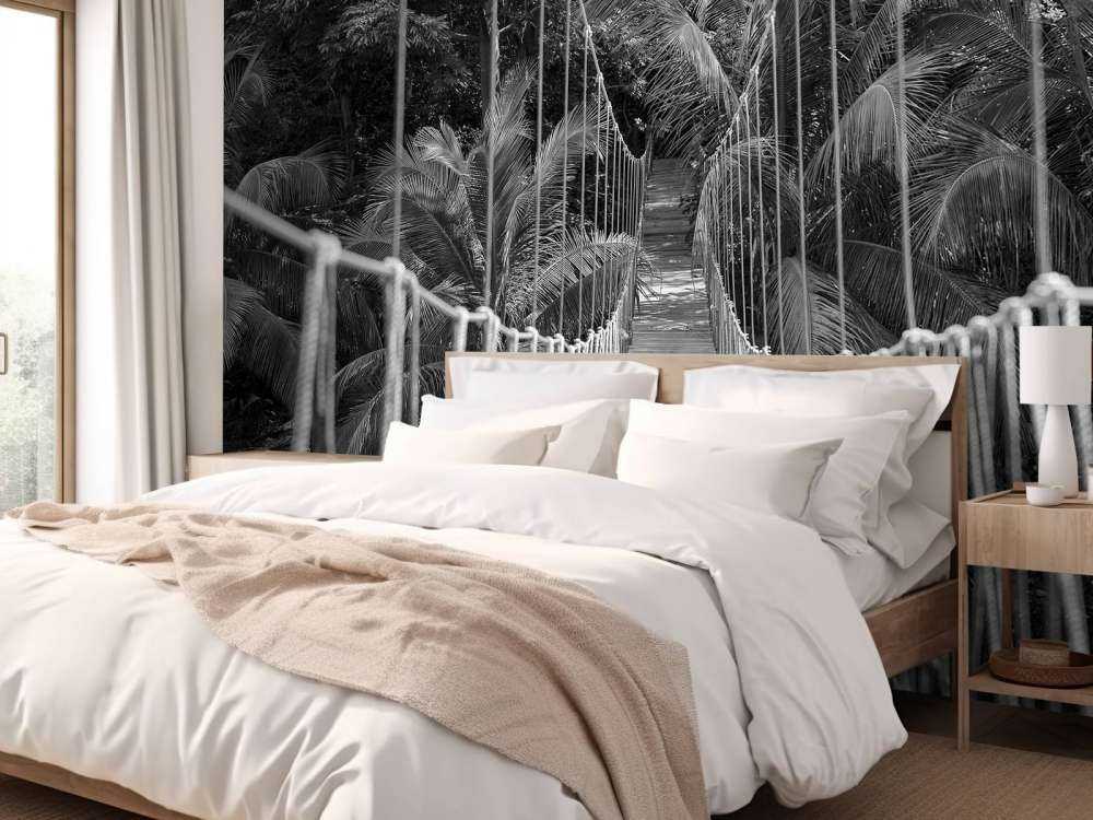 Wooden bridge between the palm trees