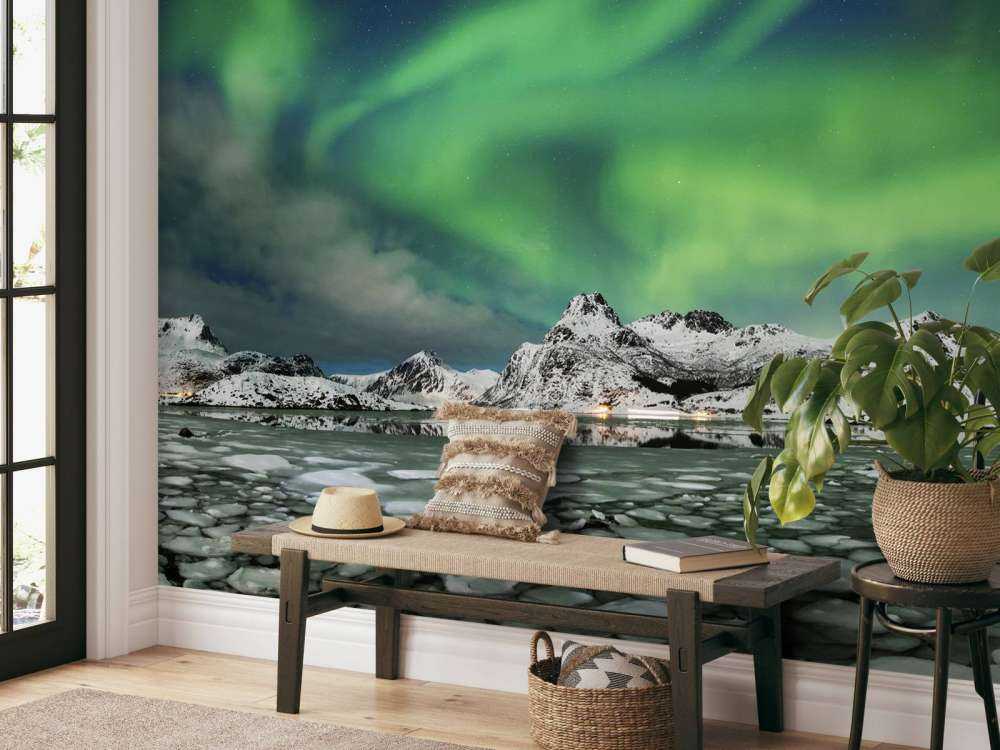 Northern lights above winter landscape