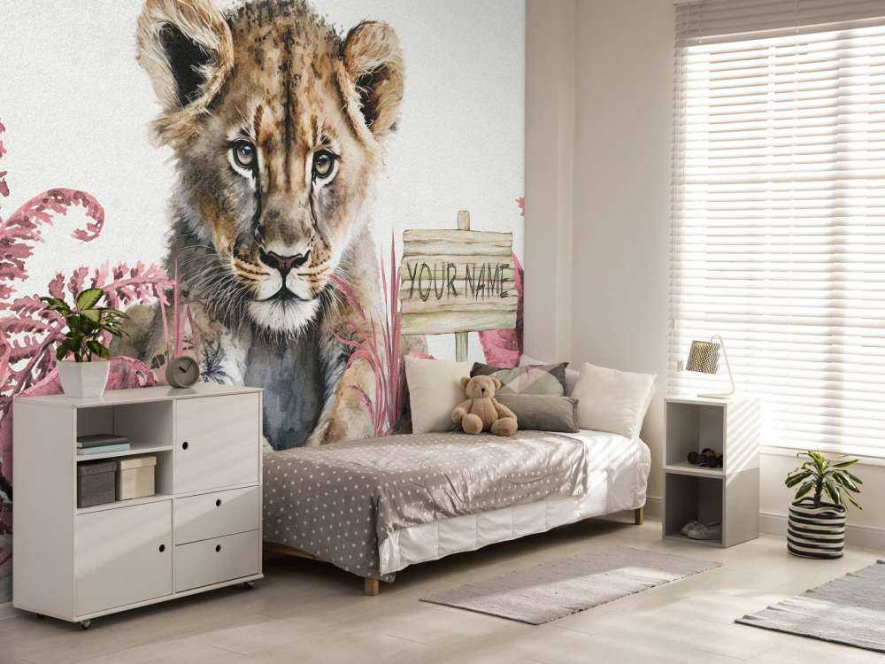 Young lion in the jungle pink