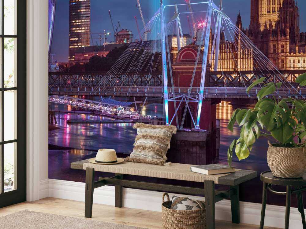 Night view of the London Eye, Golden Jubilee bridge and Westminster, London, UK