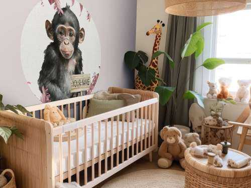 Baby chimpanzee in the jungle pink