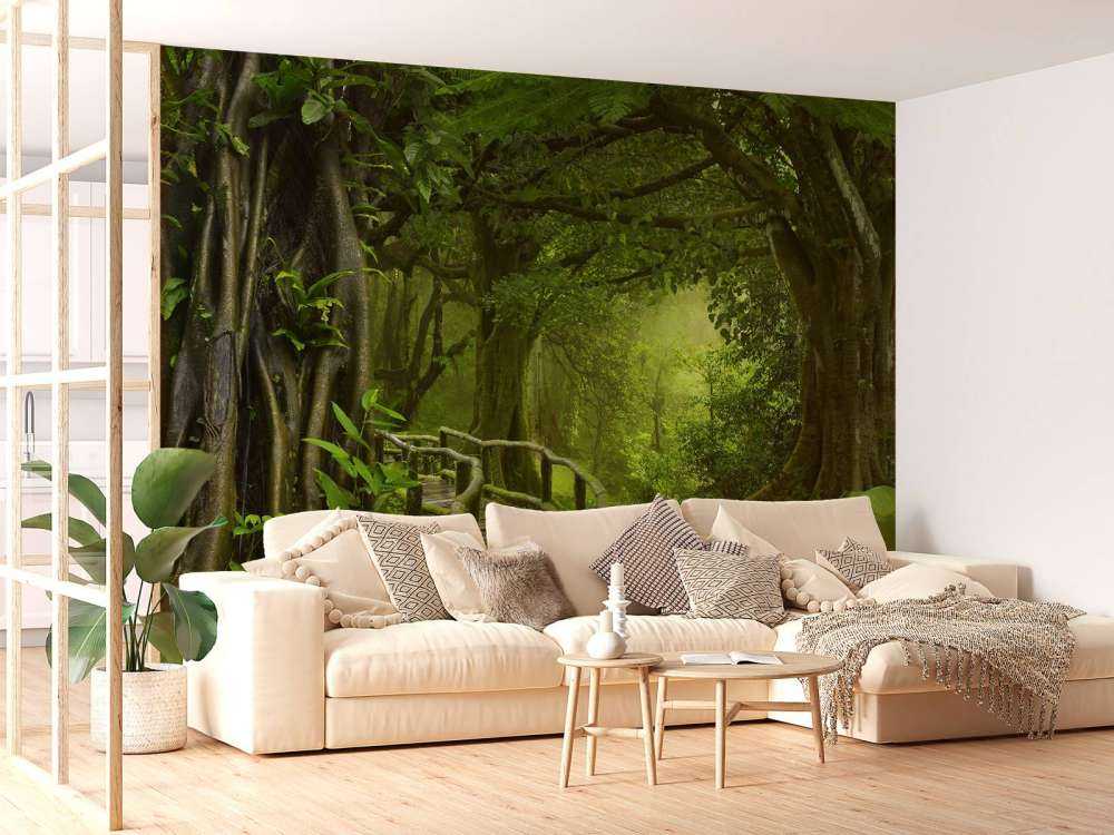 Wooden bridge through a green jungle