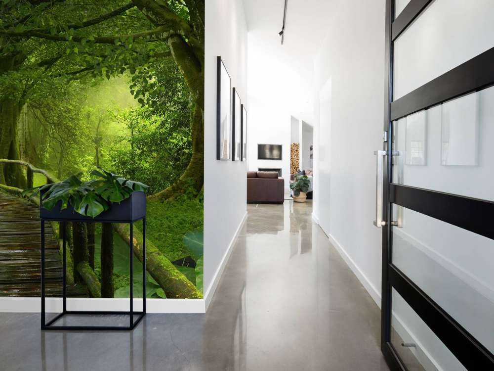 Wooden bridge through a green jungle