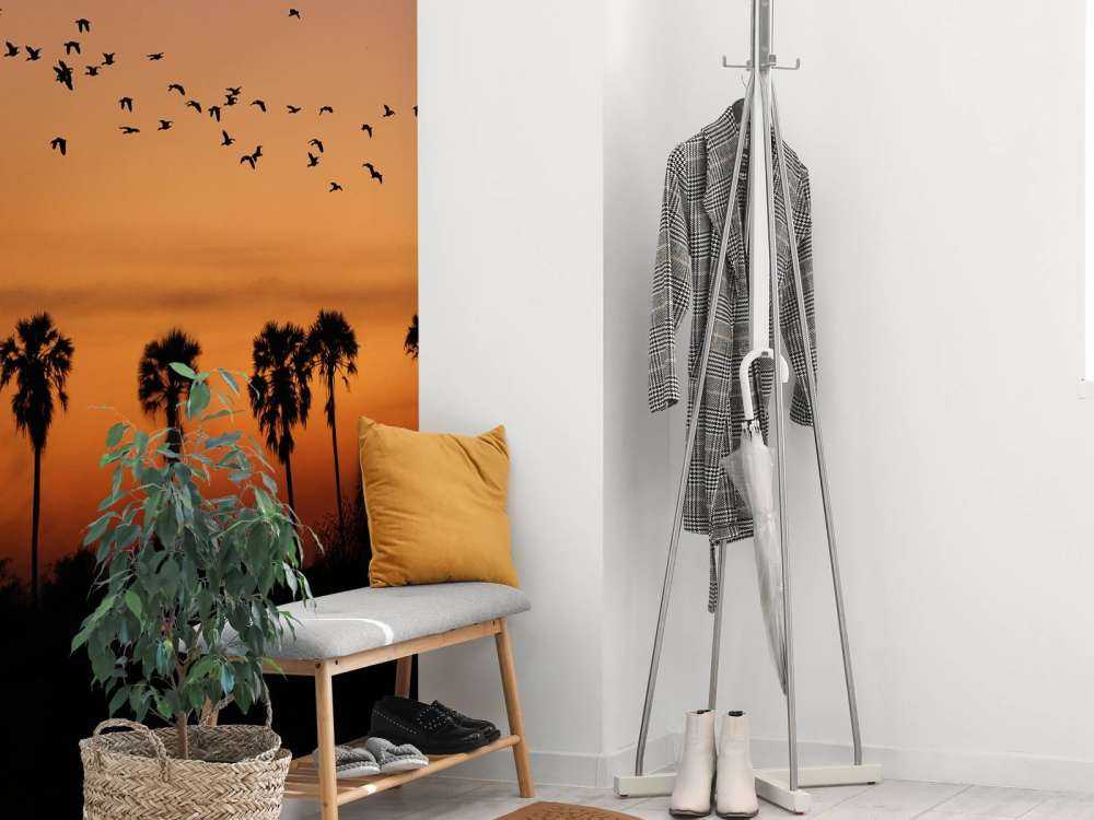 Palm trees with group of birds