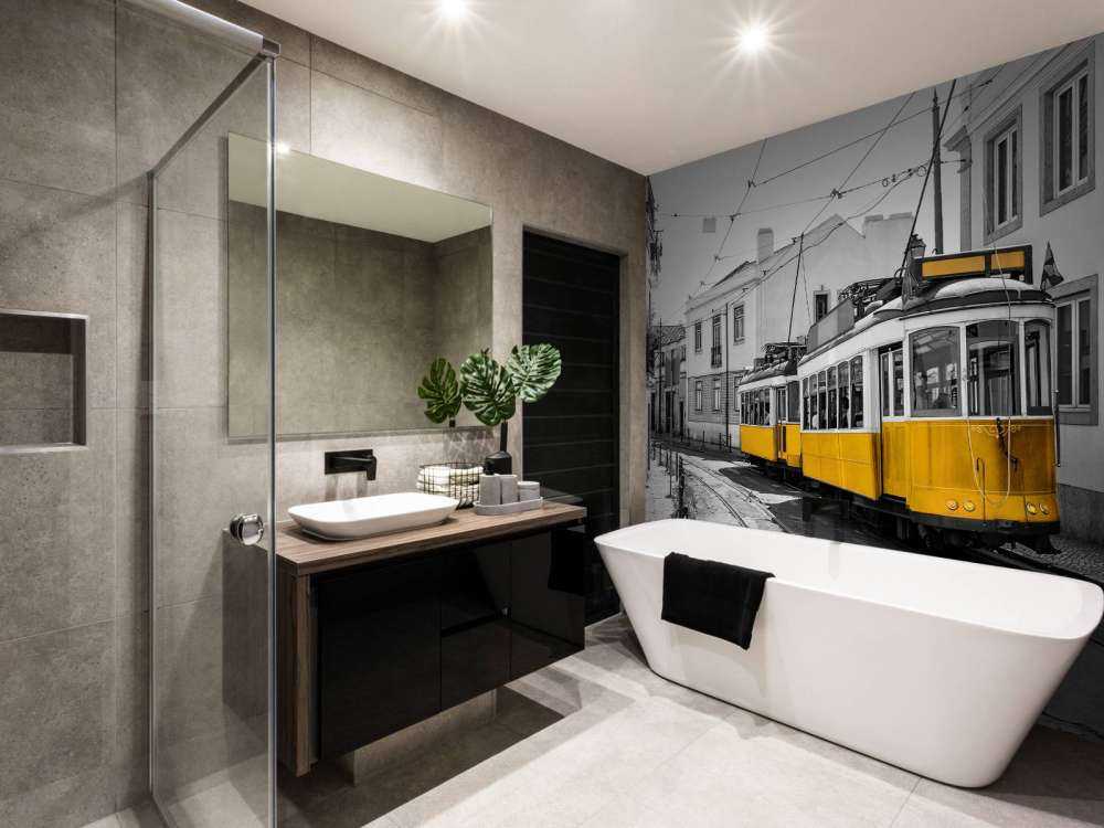 Yellow tram in a black and white street