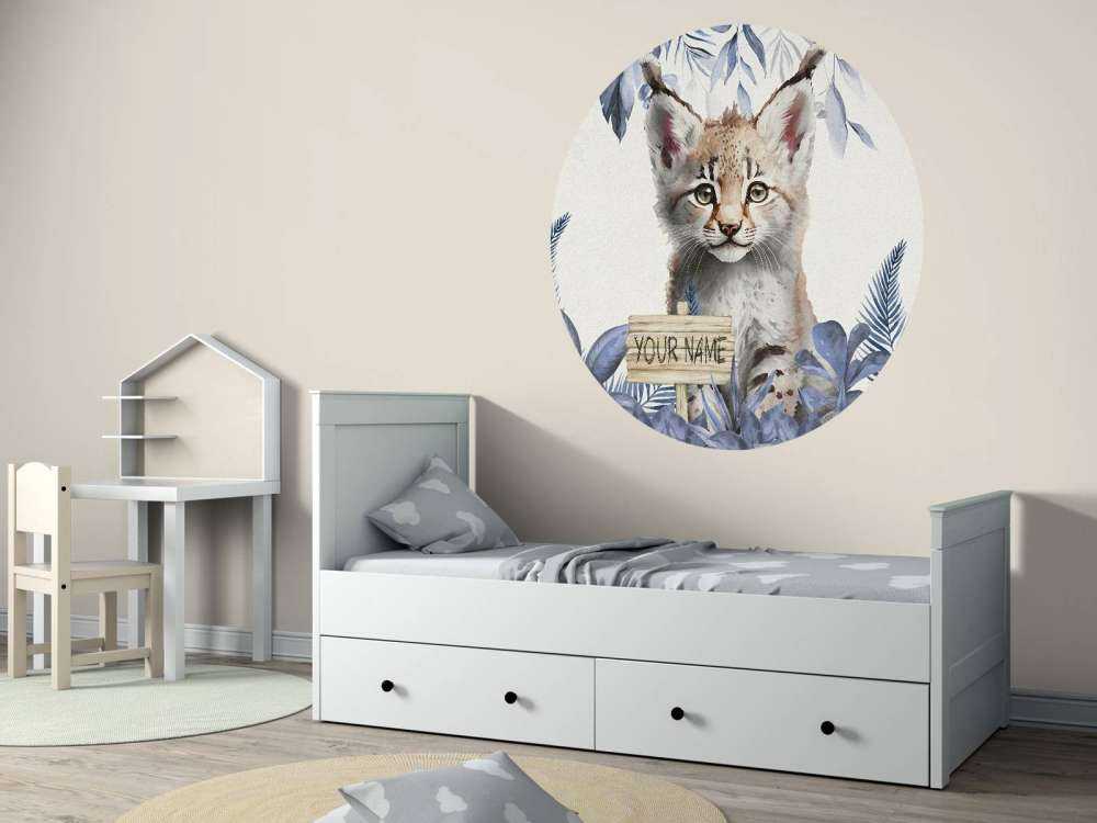 Baby lynx in the jungle blue