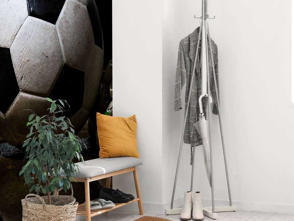 Football between two sneakers