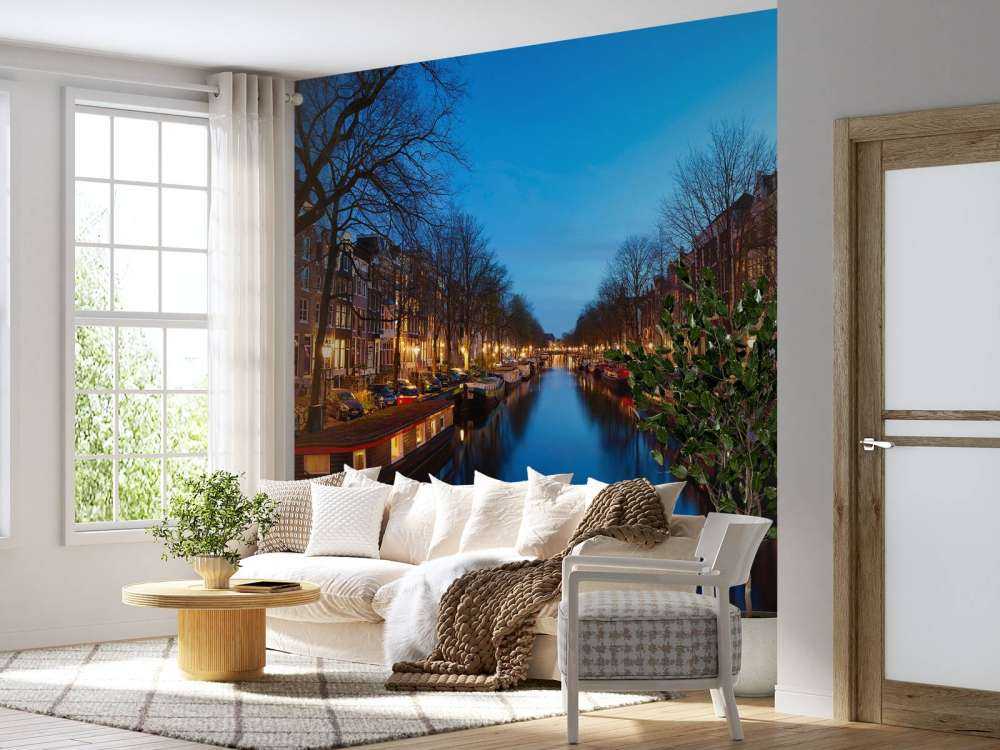 Houseboats along illuminated canal