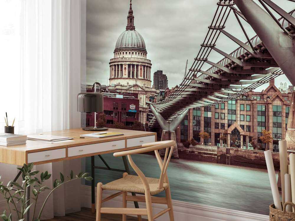 View of St Paul's Cathedral and Millennium Bridge from river thames, London, UK