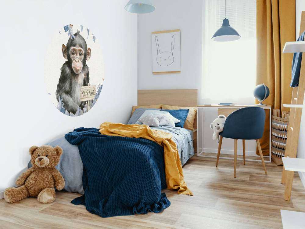 Baby chimp in the jungle blue