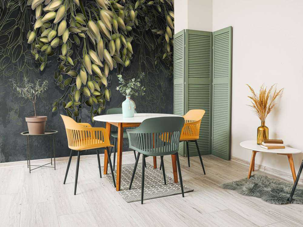 White flower calyxes on a dark gray concrete structure