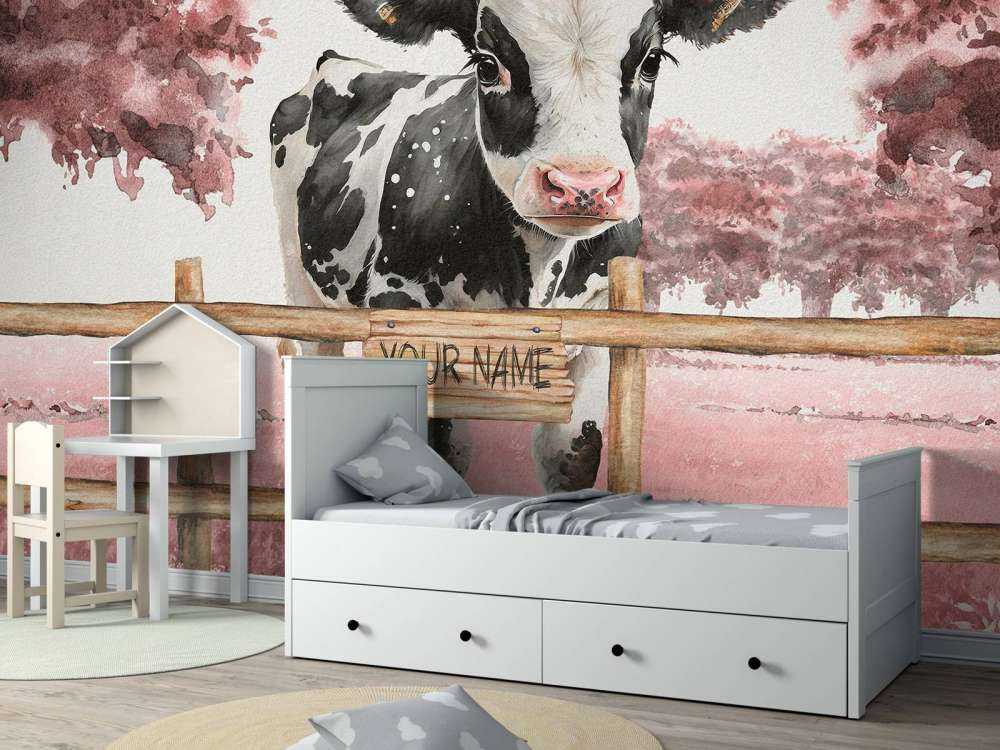 Young cow in a meadow pink