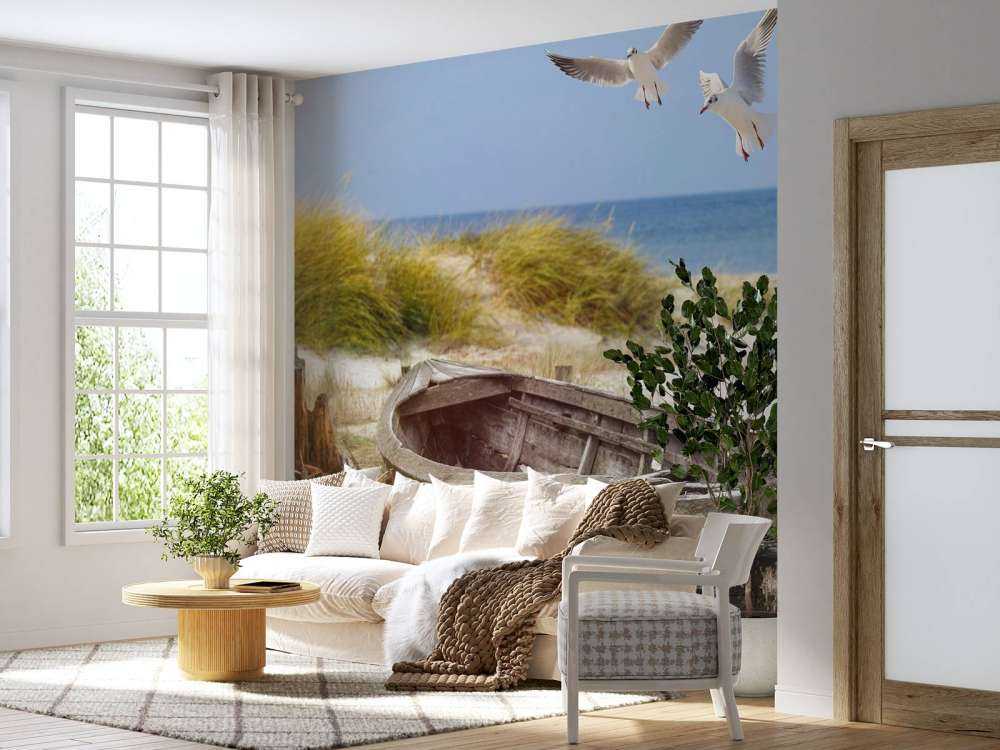 Old fishing boat, seagulls, beach and sea