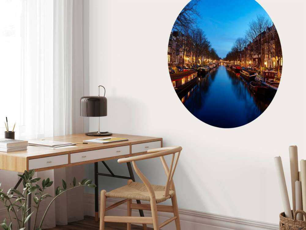 Houseboats along illuminated canal