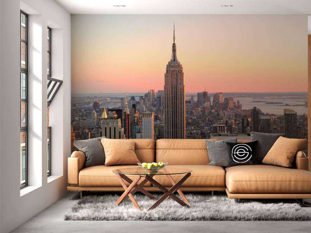 De Skyline van New York bij zonsondergang