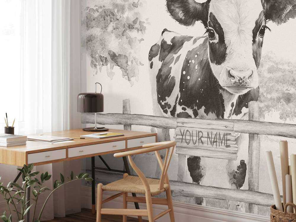 Baby cow in a field beige