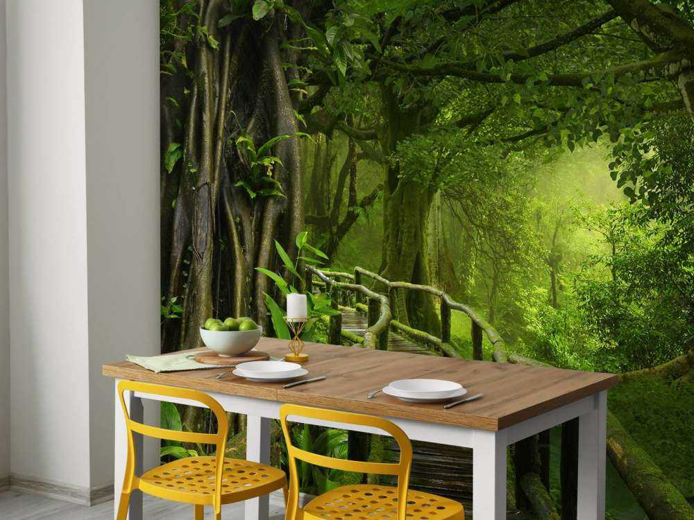 Wooden bridge through a green jungle