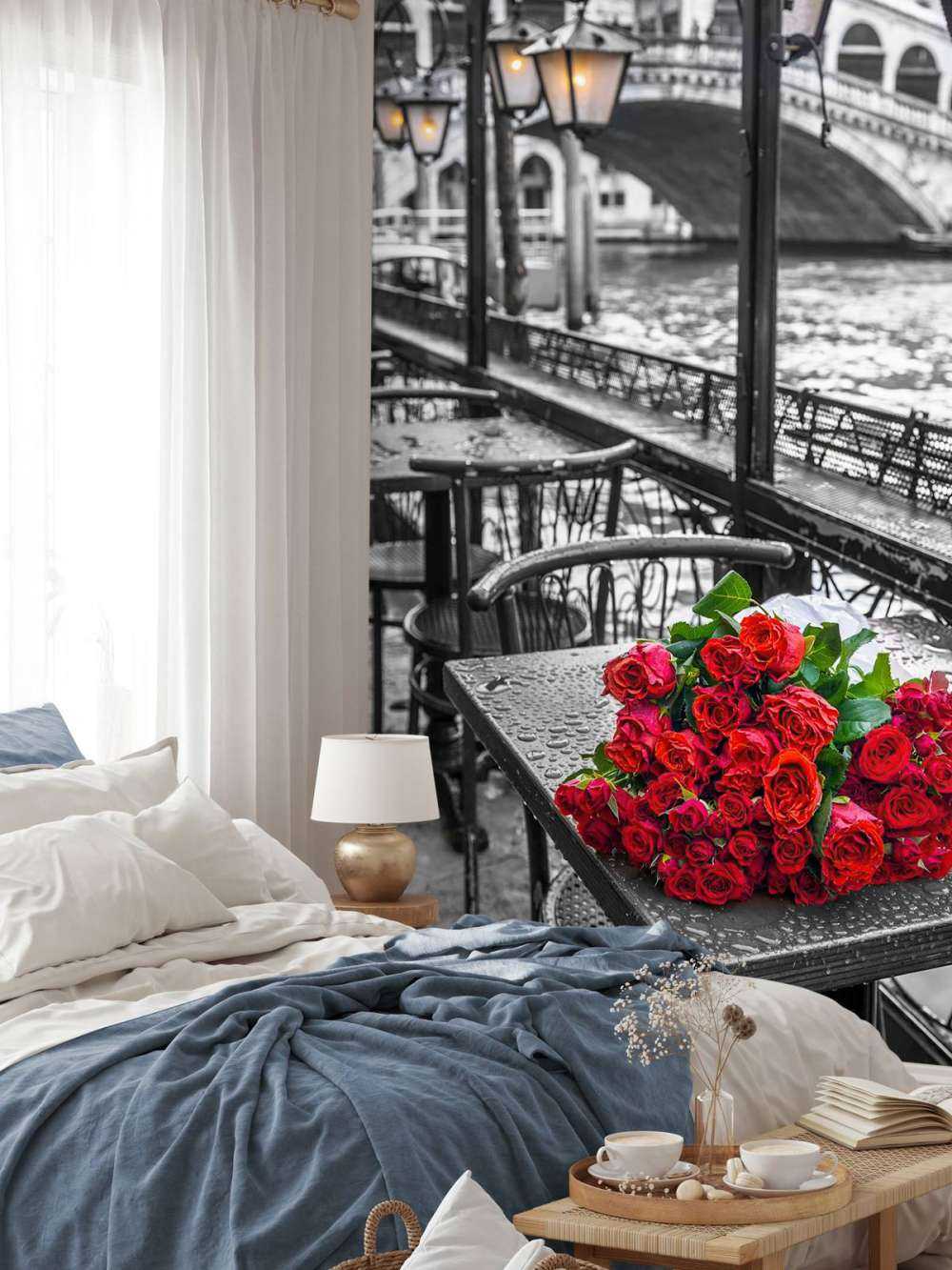 Bunch of red roses on street cafe table, Rialto Bridge, Venice, Italy