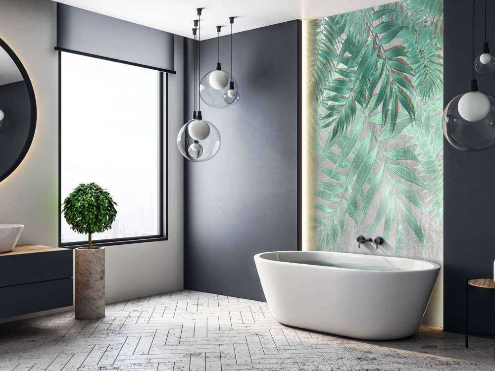 Green palm leaves with gray concrete wall