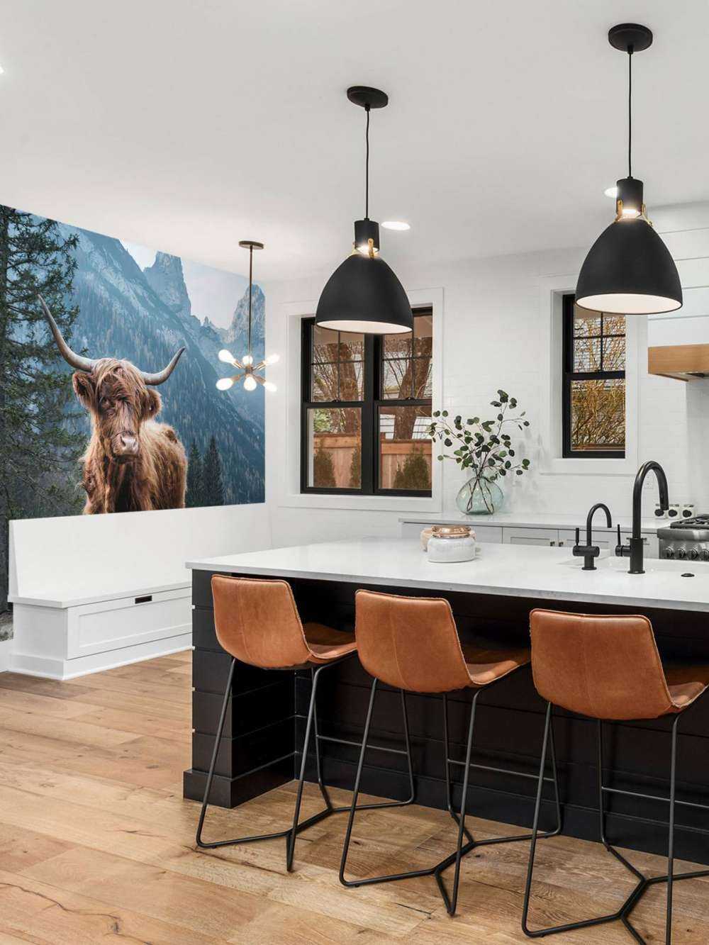 Scottish highlander among the trees