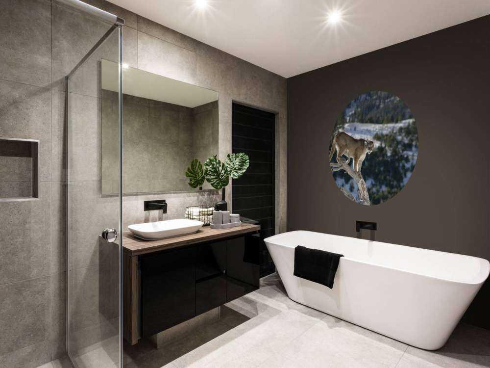 Mountain lion on a dead tree