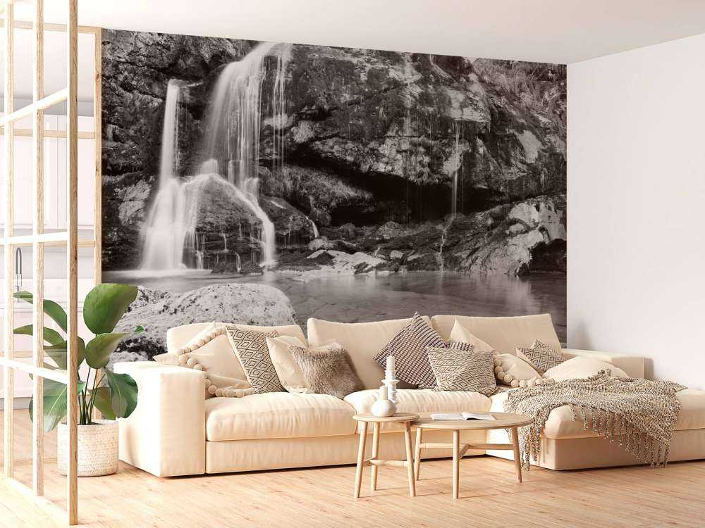 Waterfall over a stone wall 