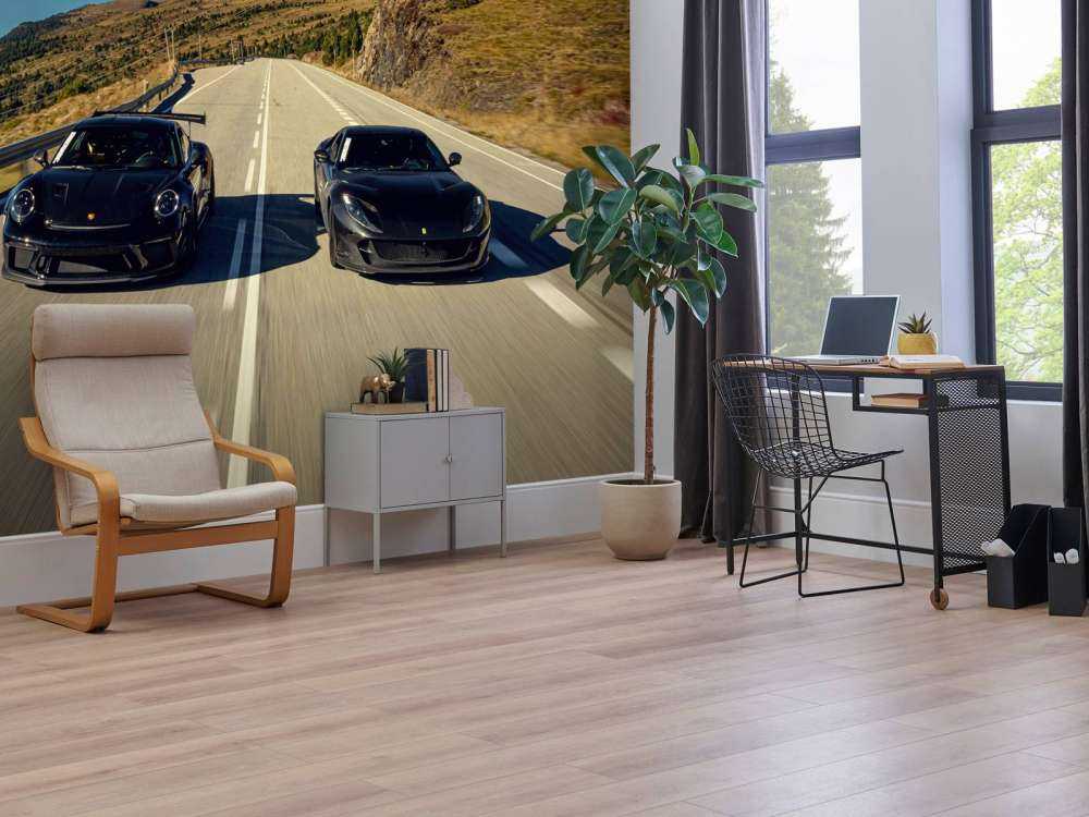 Black supercars in the mountains