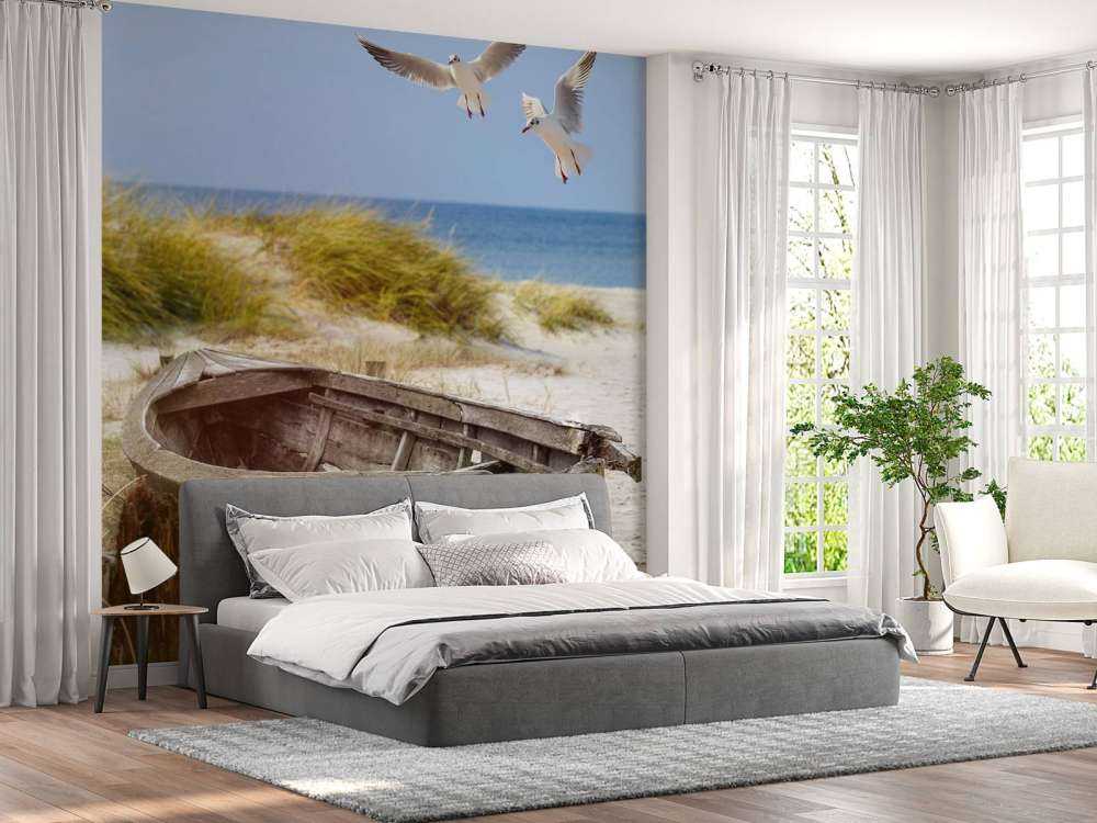 Old fishing boat, seagulls, beach and sea