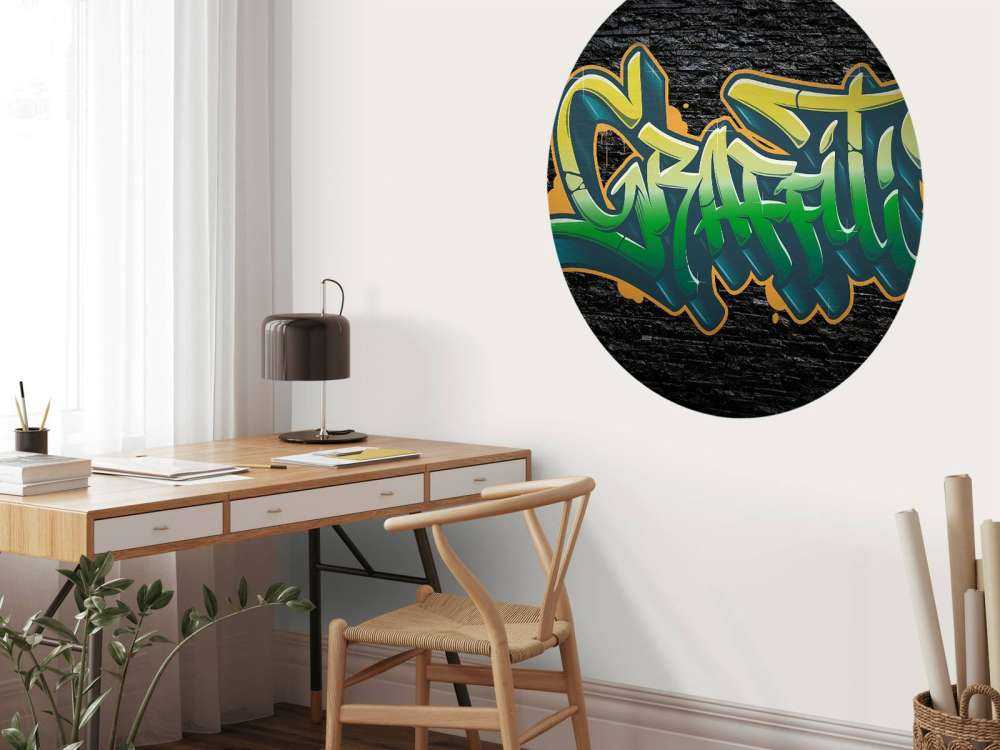 Graffiti on wall of black stones