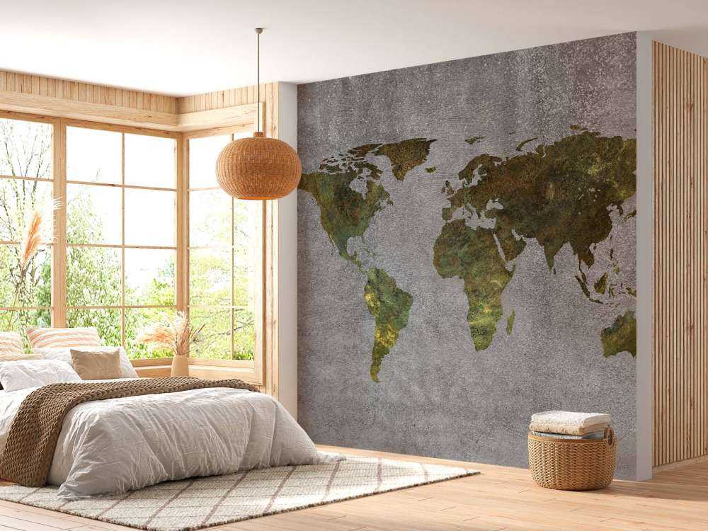 World map with green structure on grey concrete