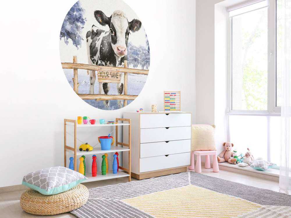 Young cow in a meadow blue