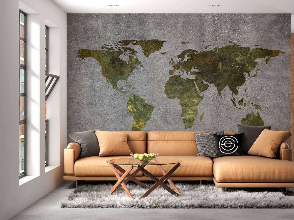 World map with green structure on grey concrete