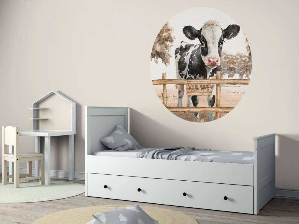 Young cow in a meadow taupe