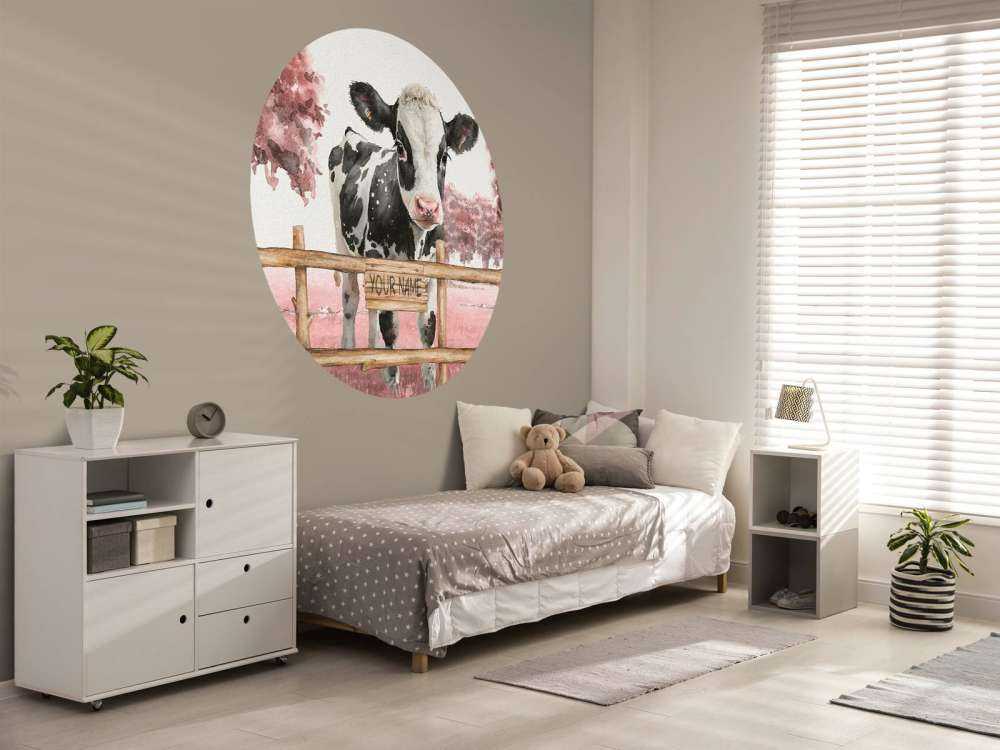 Young cow in a meadow pink