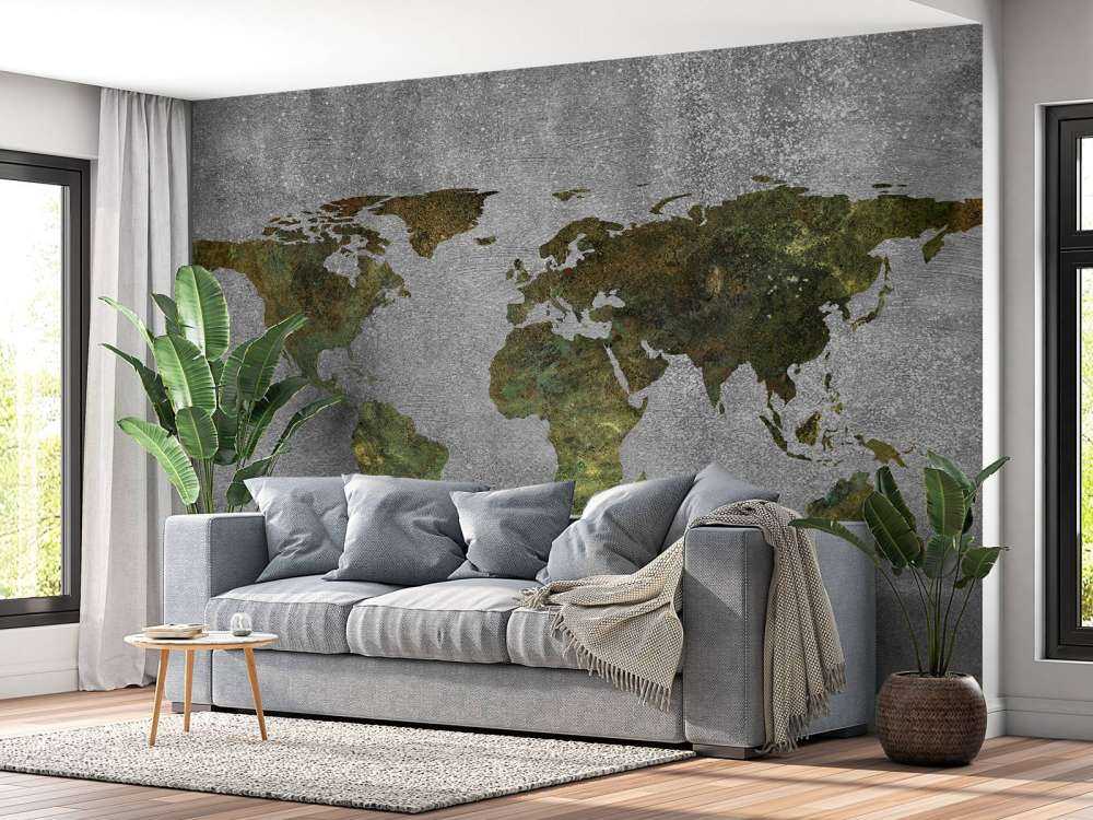 World map with green structure on grey concrete