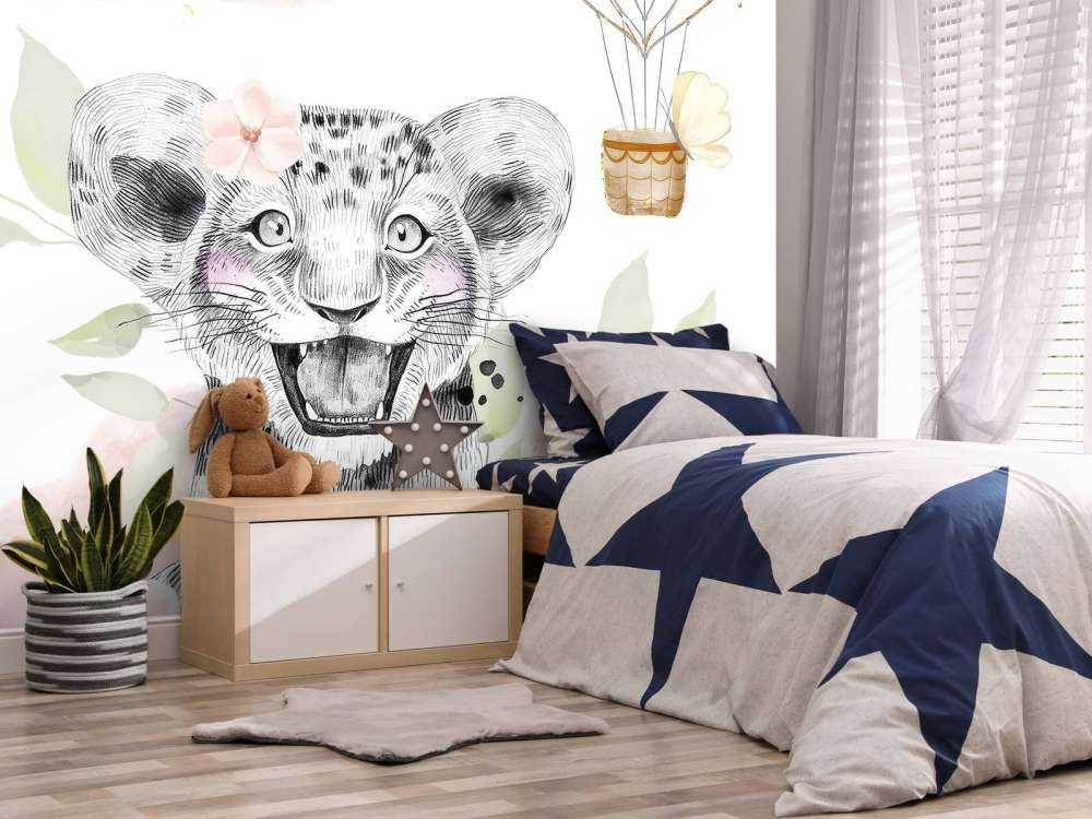 Joyful lion cub and balloon